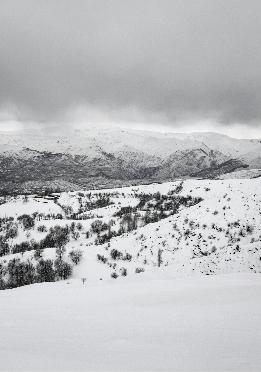 a person riding skis on top of a snow covered slope