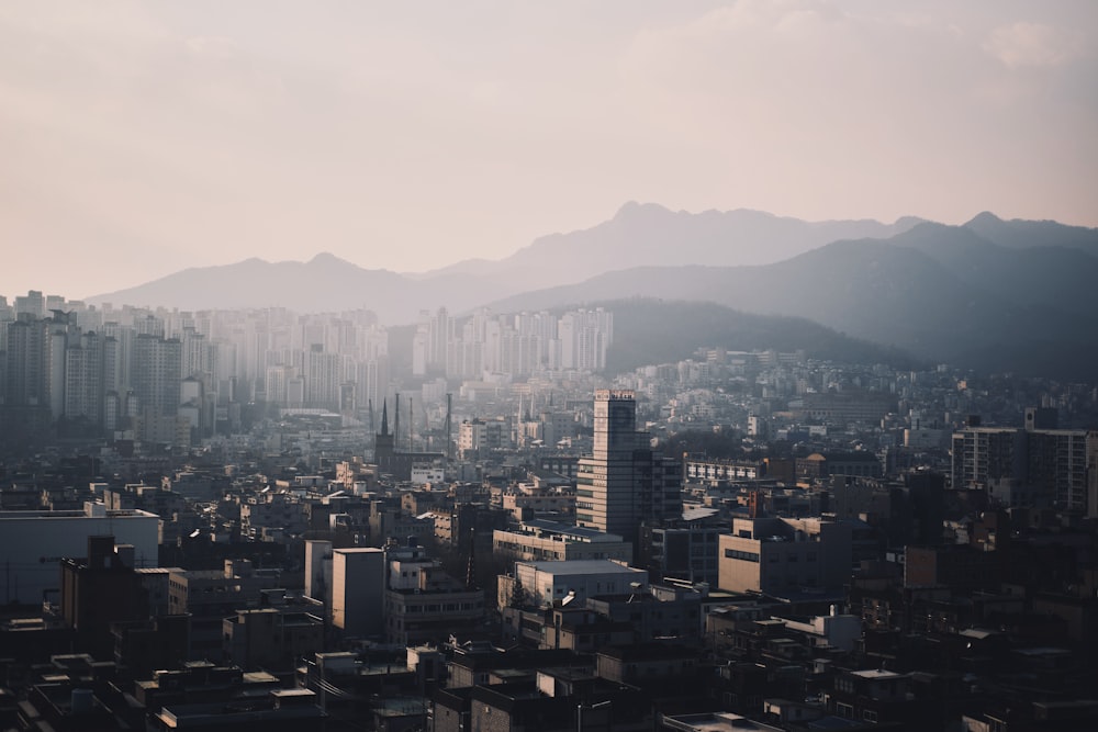 a view of a city with mountains in the background