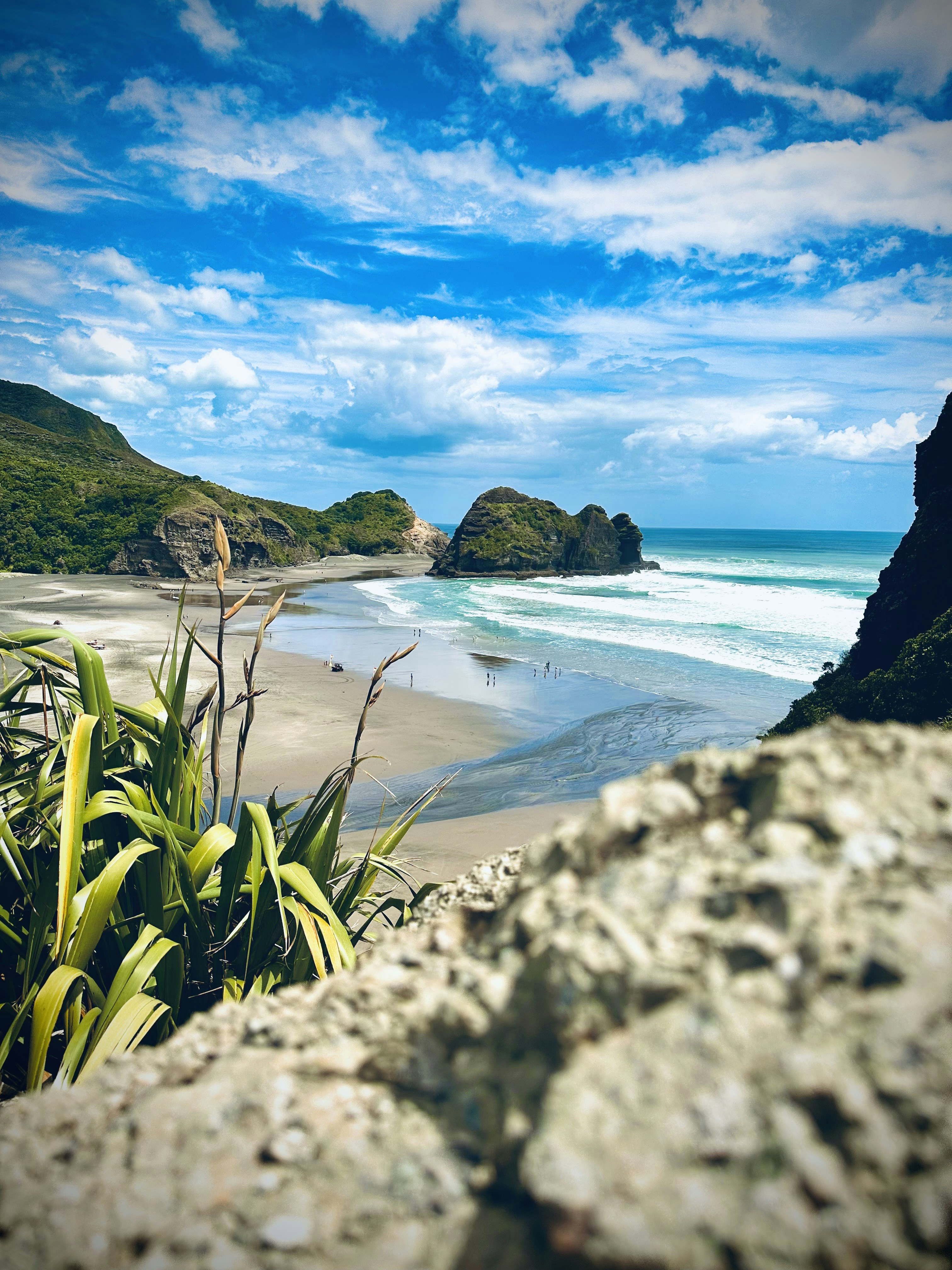 a view of a beach from a cliff