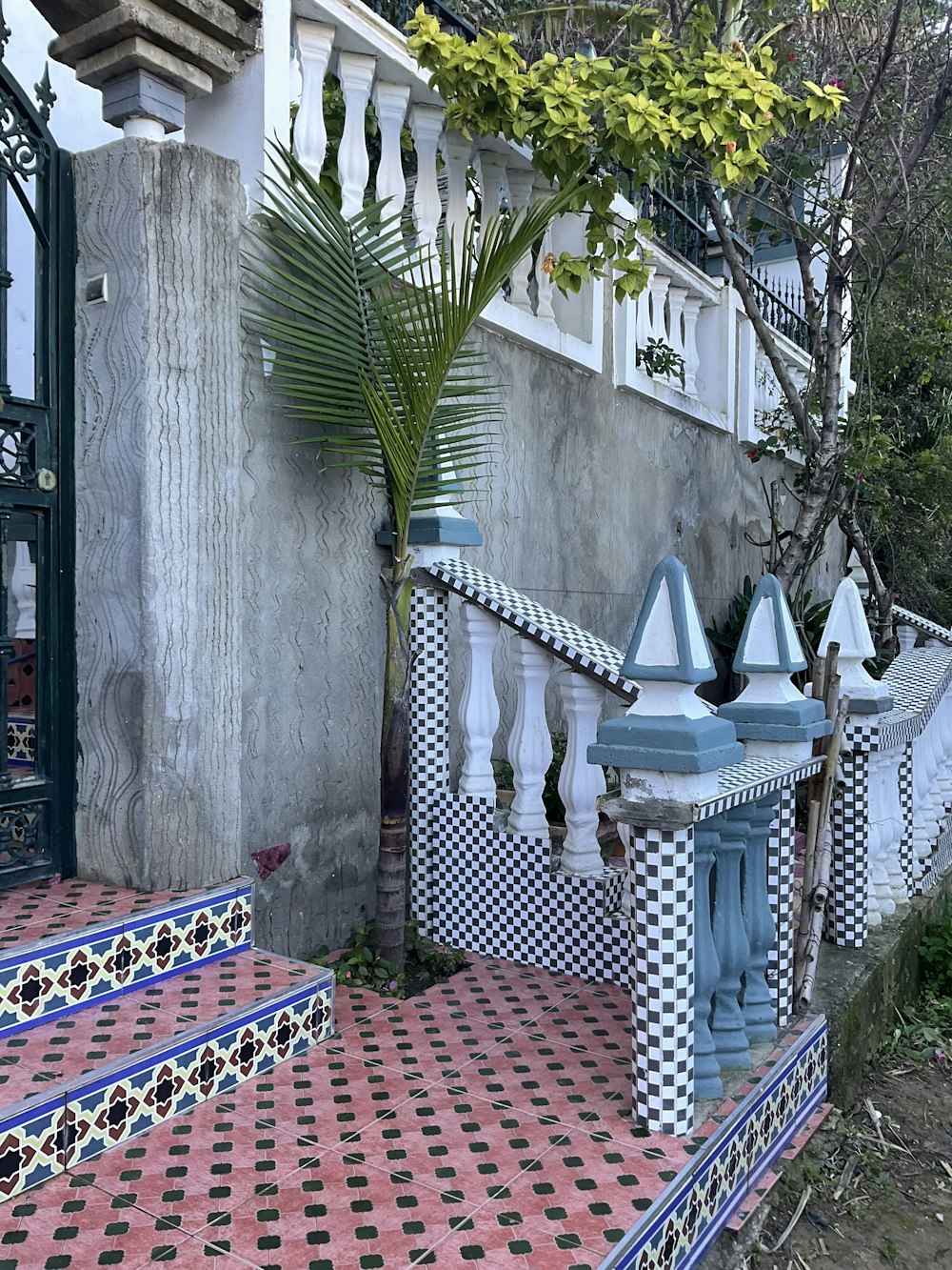 a blue and white fountain sitting in front of a building