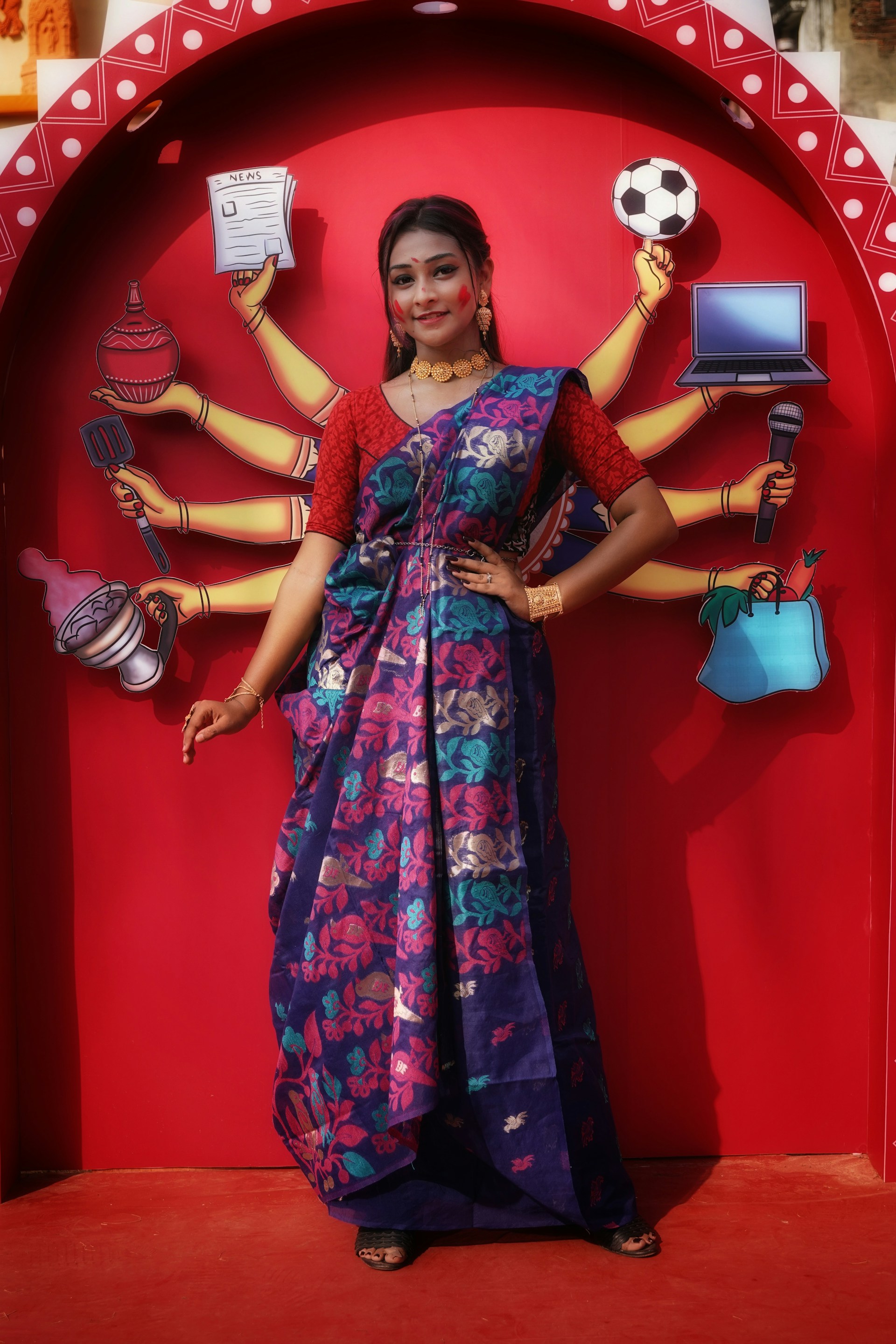 An anchor desk with a professional newsreader in traditional Indian attire, ready to deliver the evening news with vibrant cityscape in the background.
