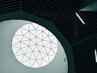 A circular window in the ceiling of a building