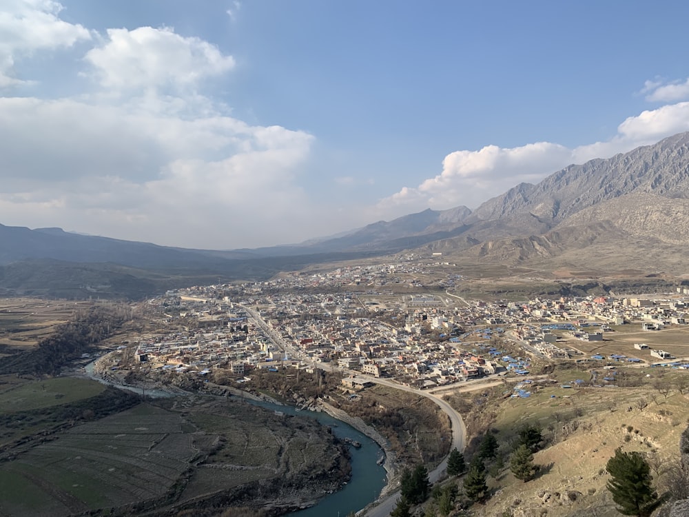 a view of a small town in the mountains