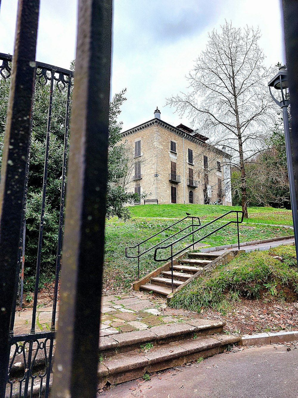 a view of a building through a gate