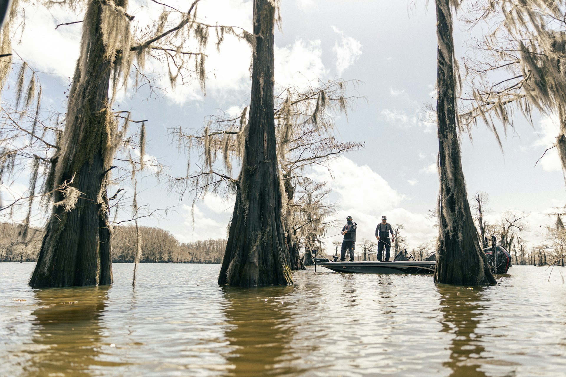 a group of people standing on a boat in the water