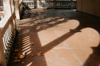 A sparkling clean terrace with sunlight casting shadows on the floor.