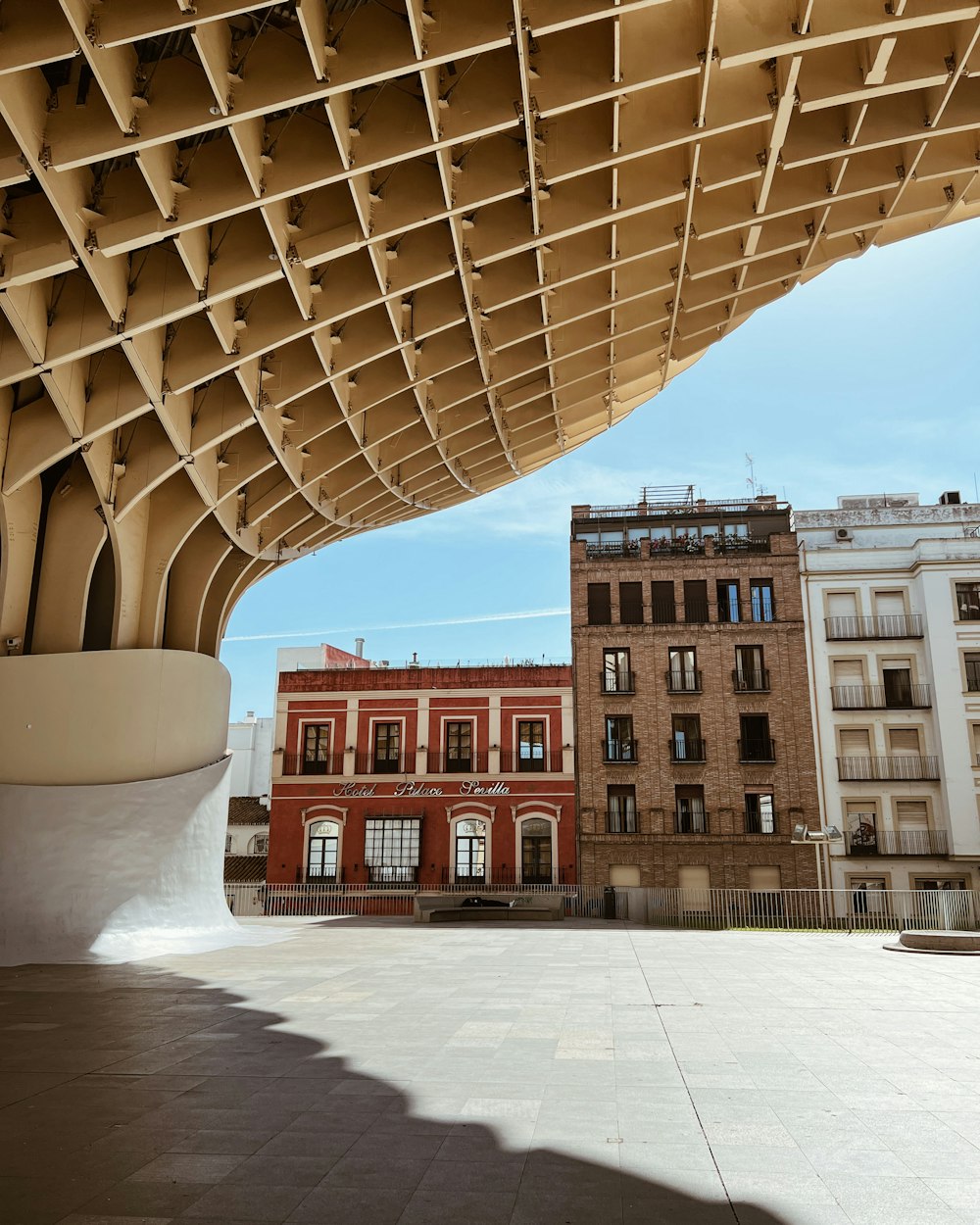 a view of a building from under a bridge