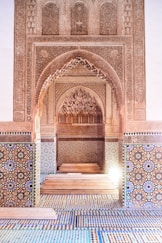 a hallway in a building with a tiled floor and walls