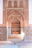 Elegant riad architecture showcasing intricate tilework and soft ambient lighting.