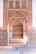 Elegant riad architecture showcasing intricate tilework and soft ambient lighting.