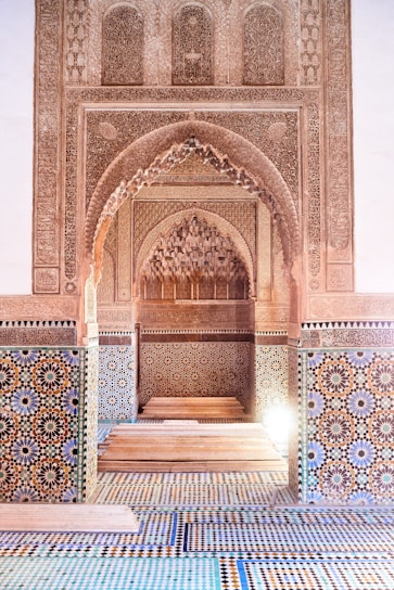 a hallway in a building with a tiled floor and walls