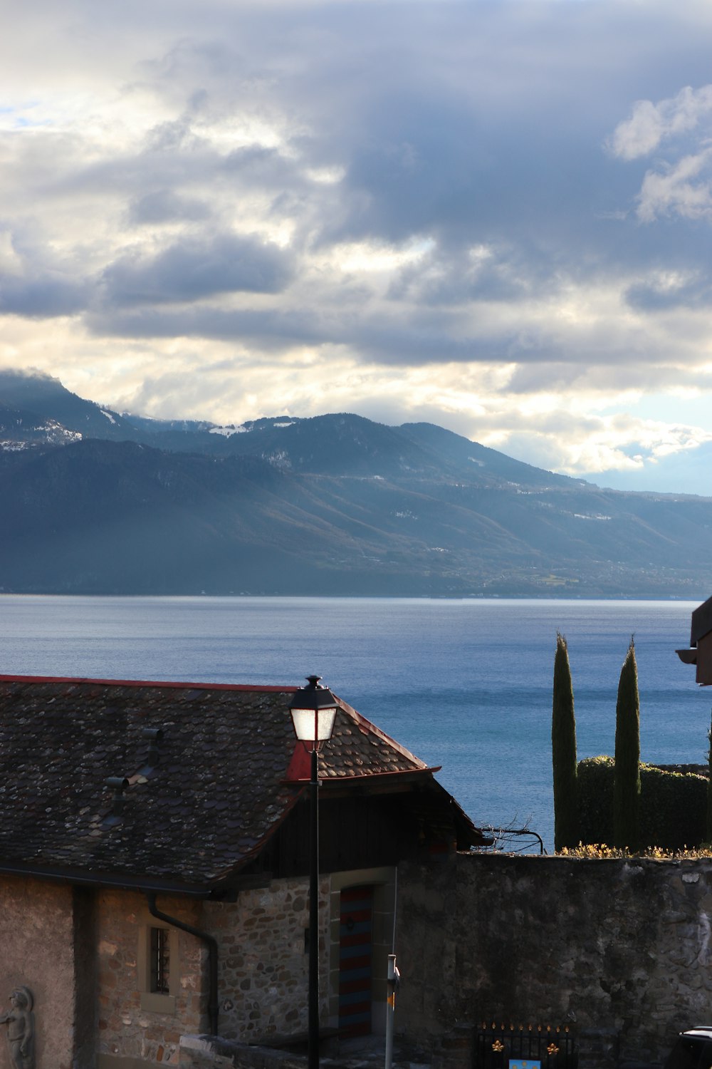 a view of a body of water with mountains in the background