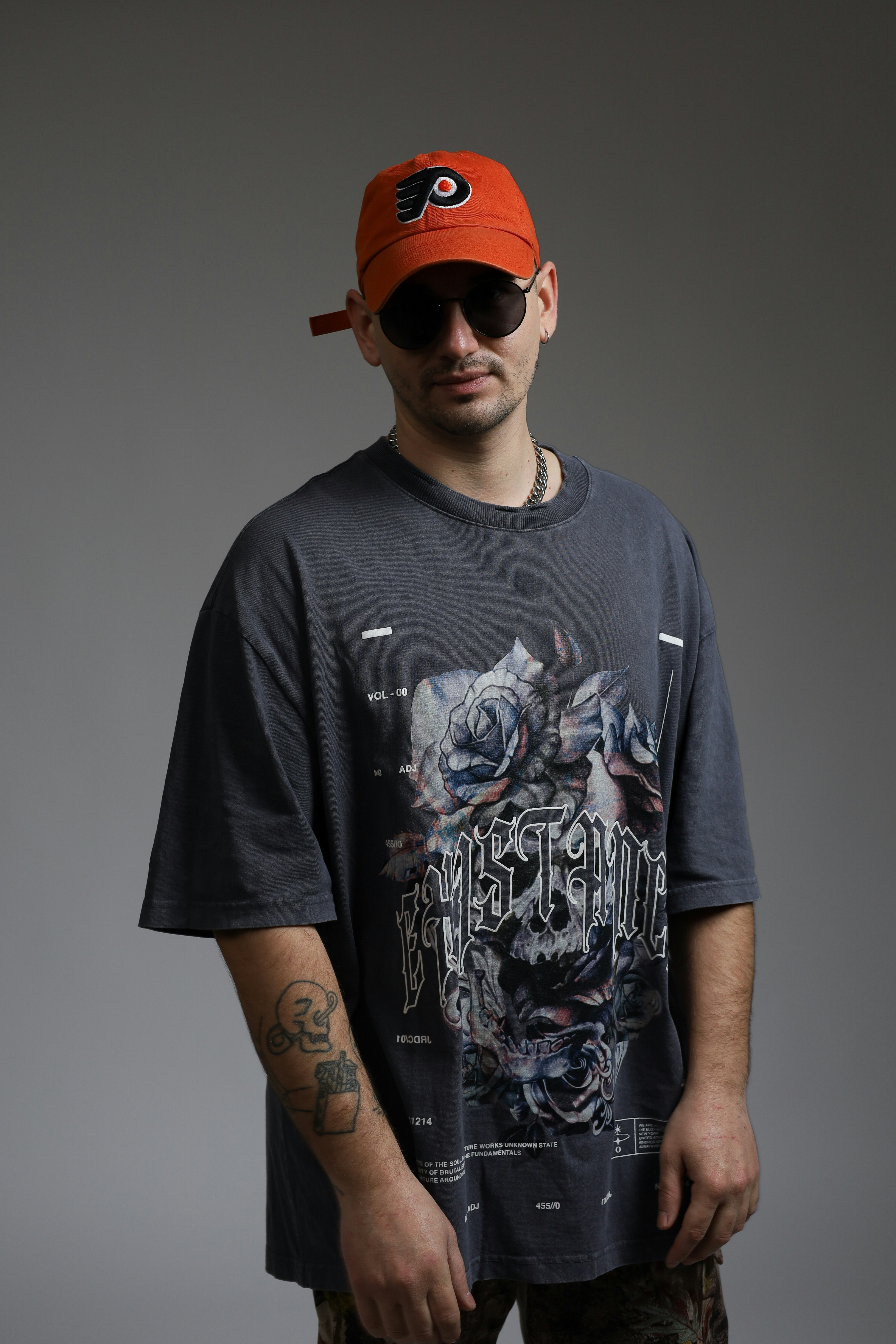 Distressed tee with a blazer &ndash; proving that a distressed tee can easily elevate your look with the right layering and accessories.