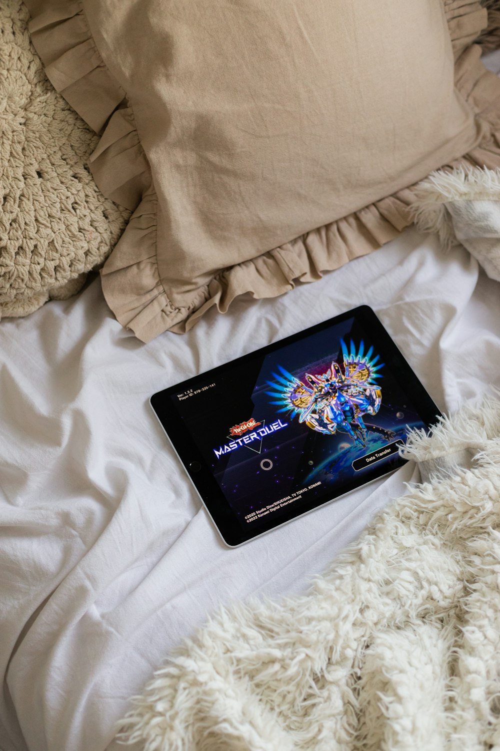 a laptop computer sitting on top of a bed