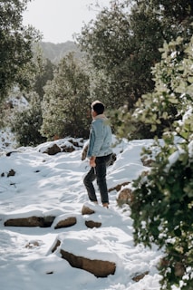 An outdoor scene featuring a person enjoying nature in a sustainable jacket.