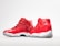 A pair of red high-top sneakers with glossy finish and white soles. One shoe is positioned facing forward, while the other is angled to show the side profile. The design features mesh fabric and a distinct black logo on the heel.