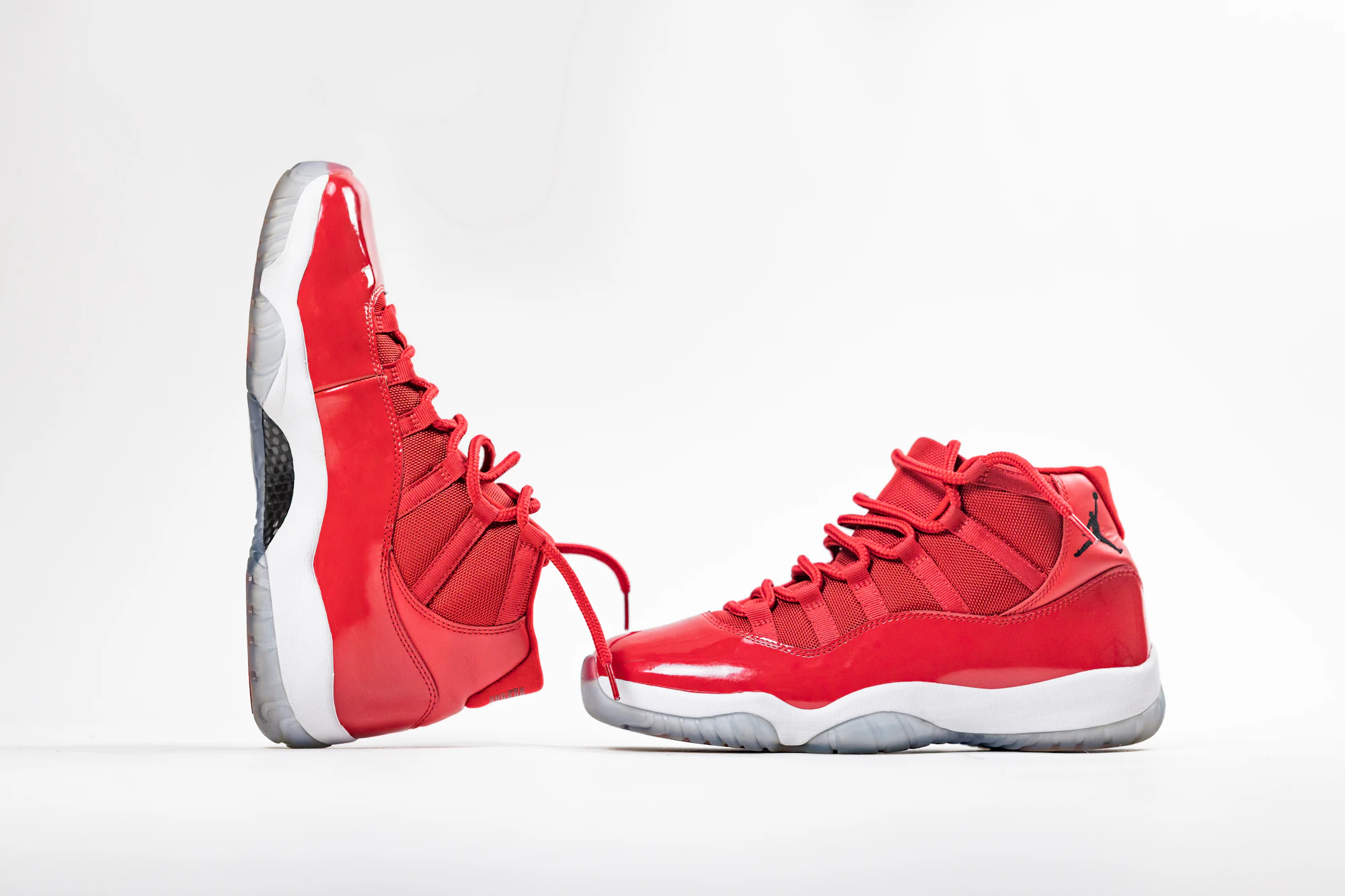 Studio photograph of minimalist red sneakers on white