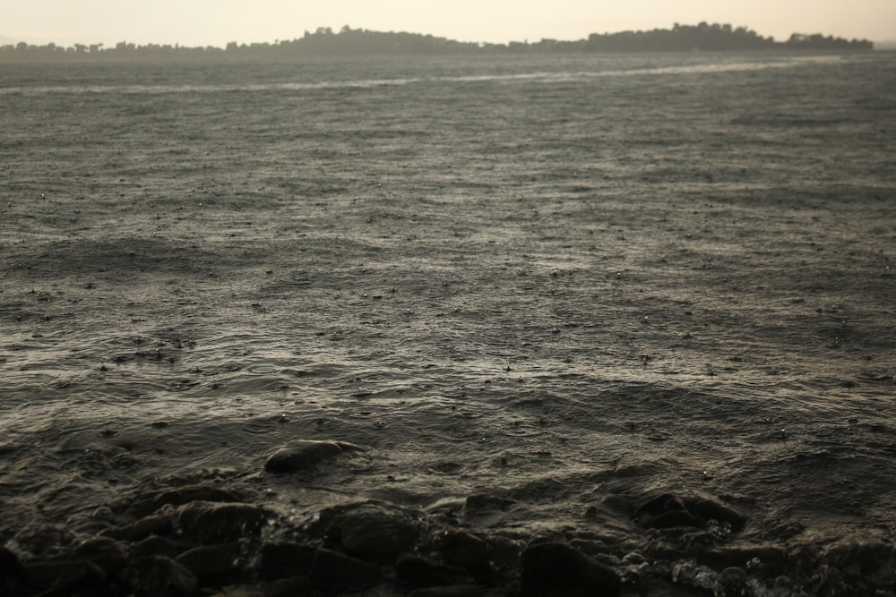 a body of water with a small island in the distance