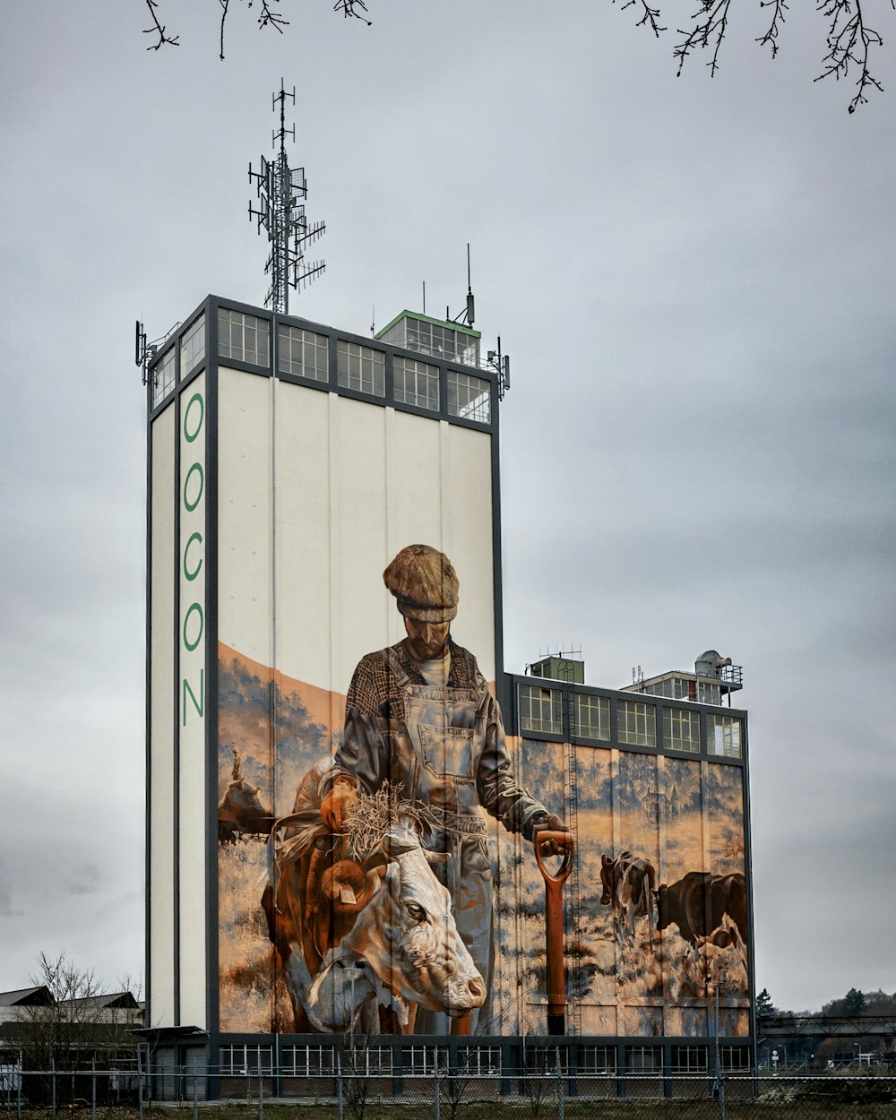 a large billboard with a man on a cow