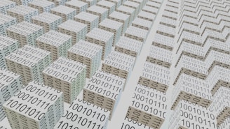 An abstract scene featuring numerous 3D cubes arranged in a grid-like pattern, each covered with binary code 0s and 1s. The perspective and repetition create a sense of depth and complexity, suggesting a digital or technological theme.
