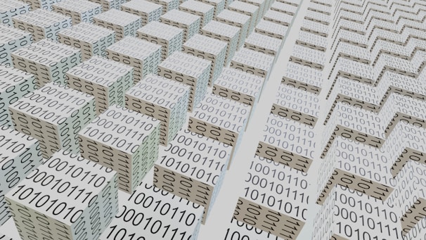 An abstract scene featuring numerous 3D cubes arranged in a grid-like pattern, each covered with binary code 0s and 1s. The perspective and repetition create a sense of depth and complexity, suggesting a digital or technological theme.