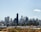 A modern city skyline with residential buildings symbolizing real estate growth and investment.