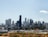 A modern city skyline with residential buildings symbolizing real estate growth and investment.