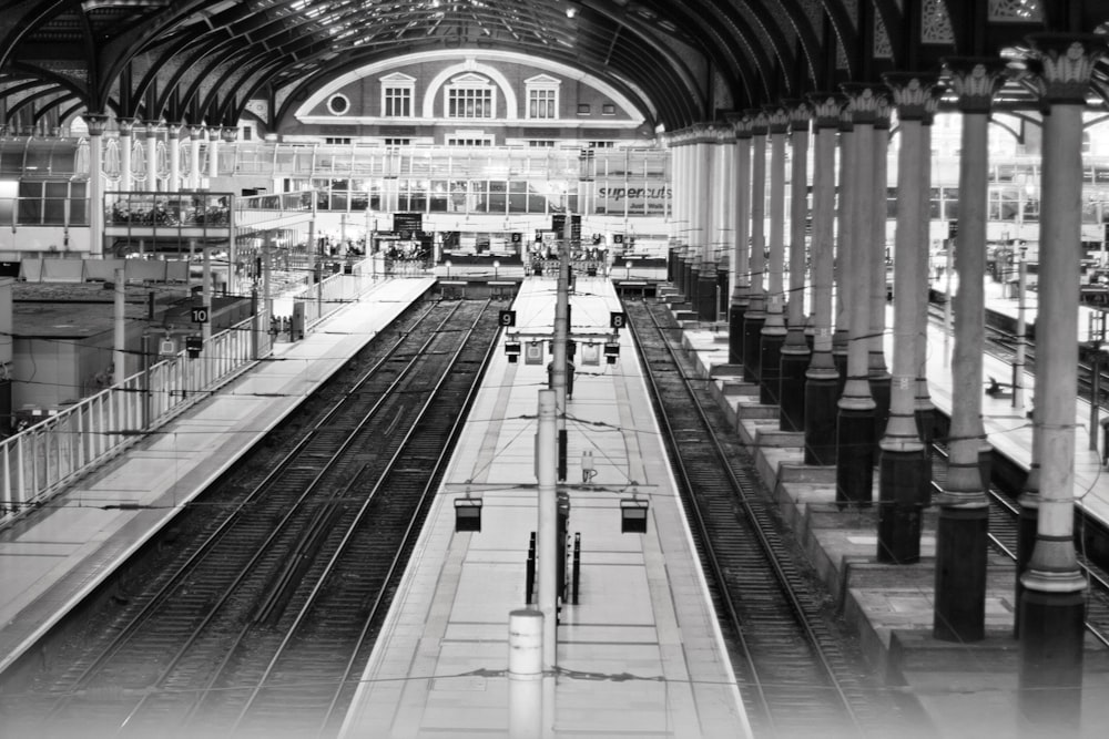 a black and white photo of a train station