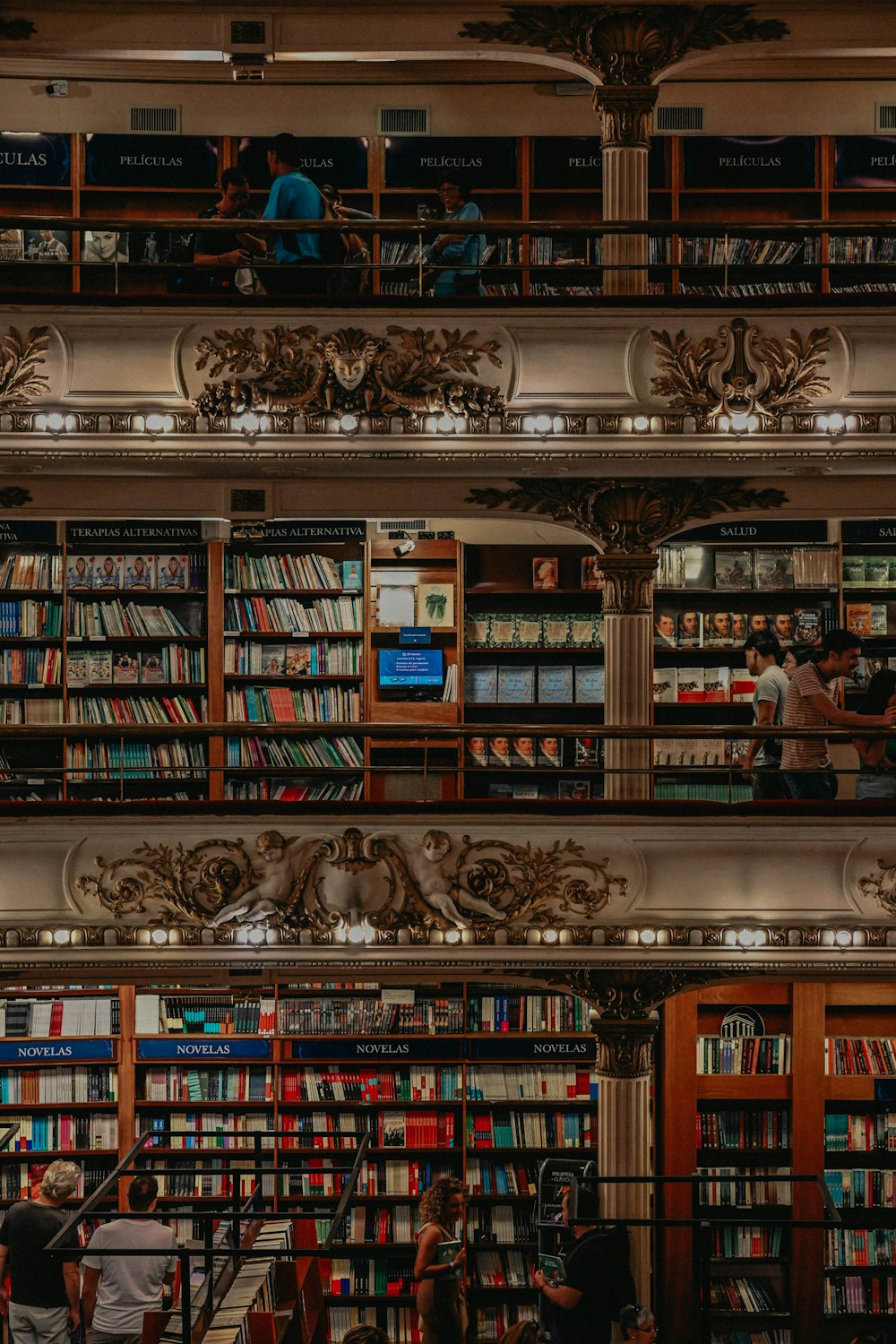 a library filled with lots of books and people