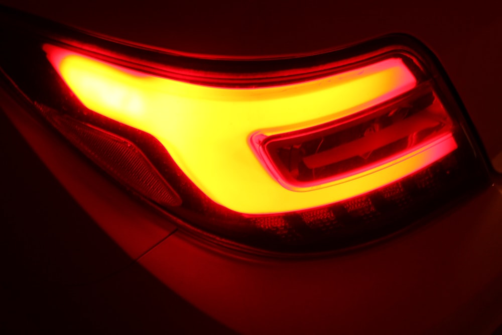 the tail light of a car in the dark