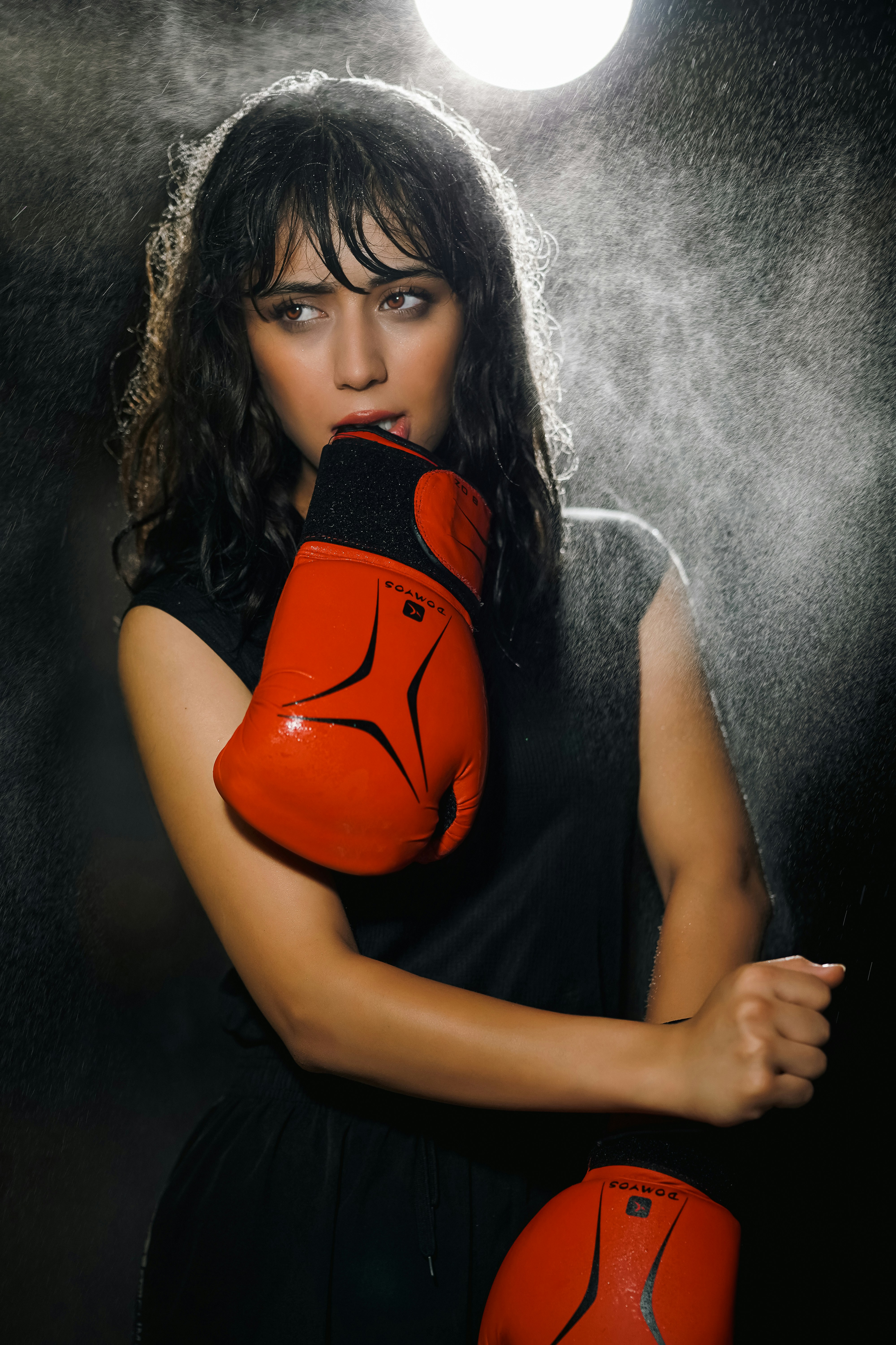A woman in a black dress and red boxing gloves photo  Free Image on  Unsplash