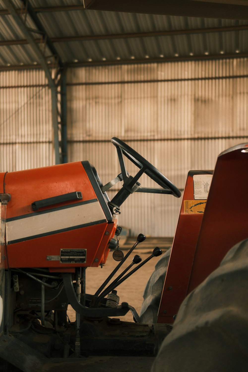 a red and white machine sitting inside of a building