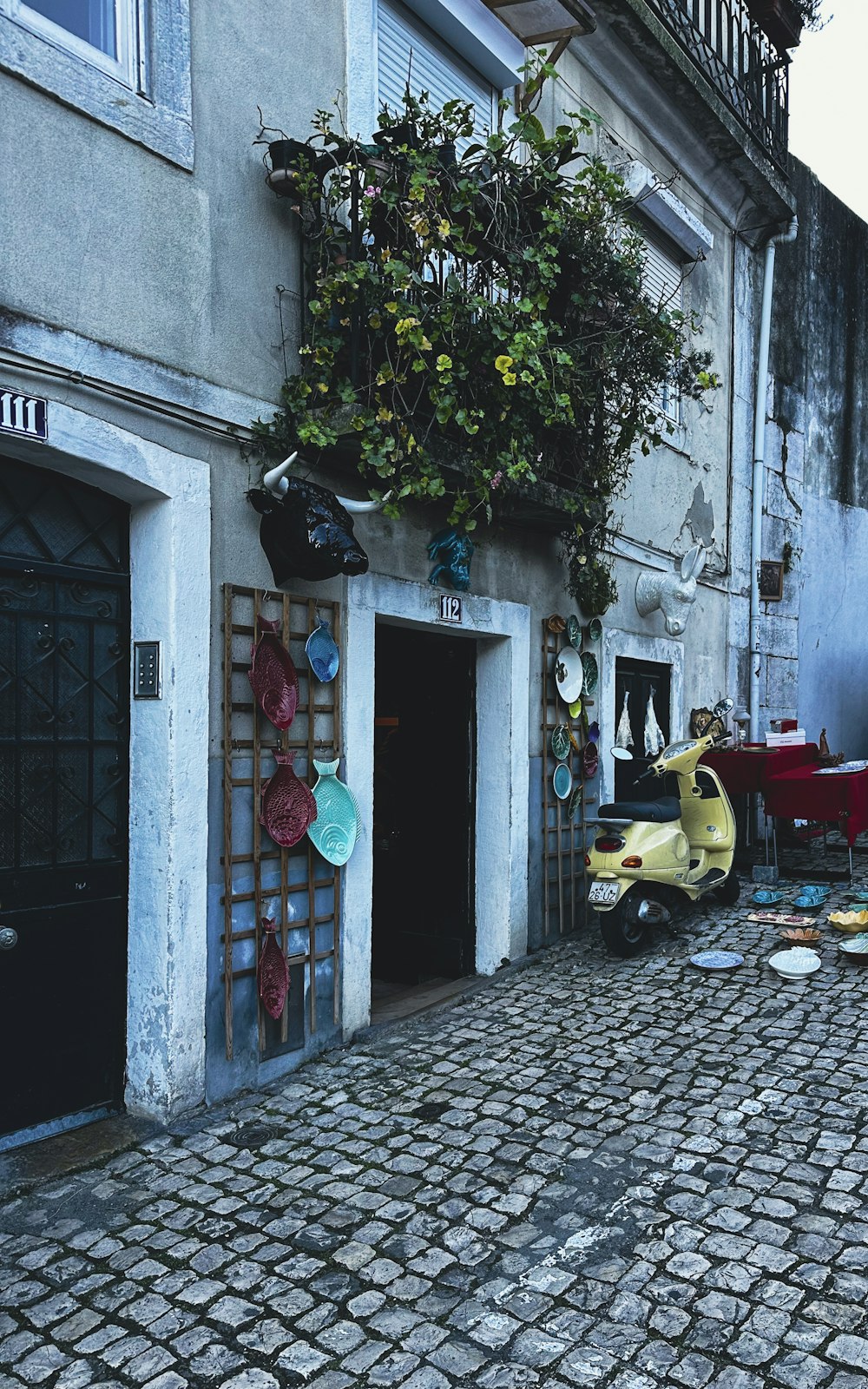 a yellow scooter parked in front of a building