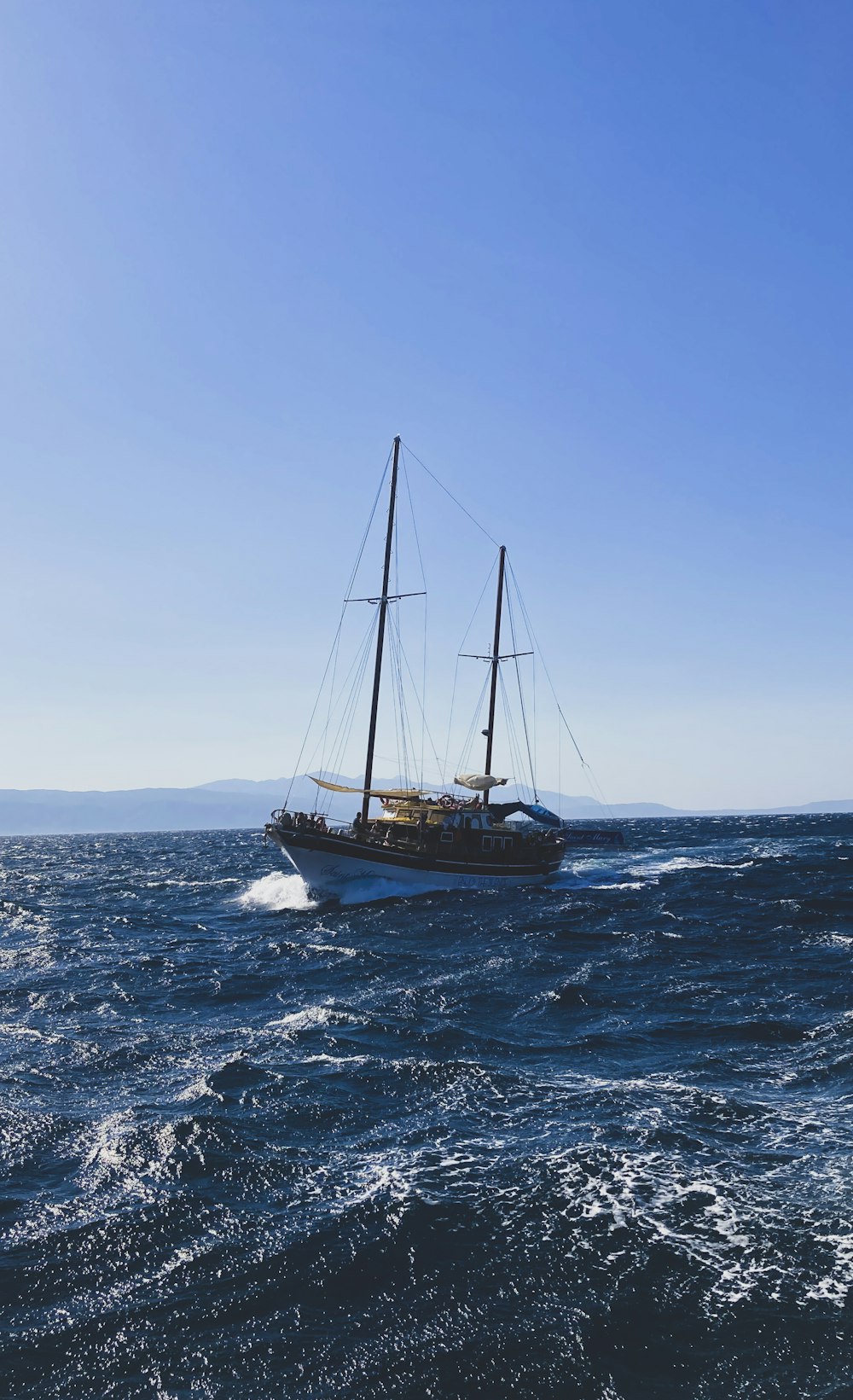 a sailboat in the middle of the ocean