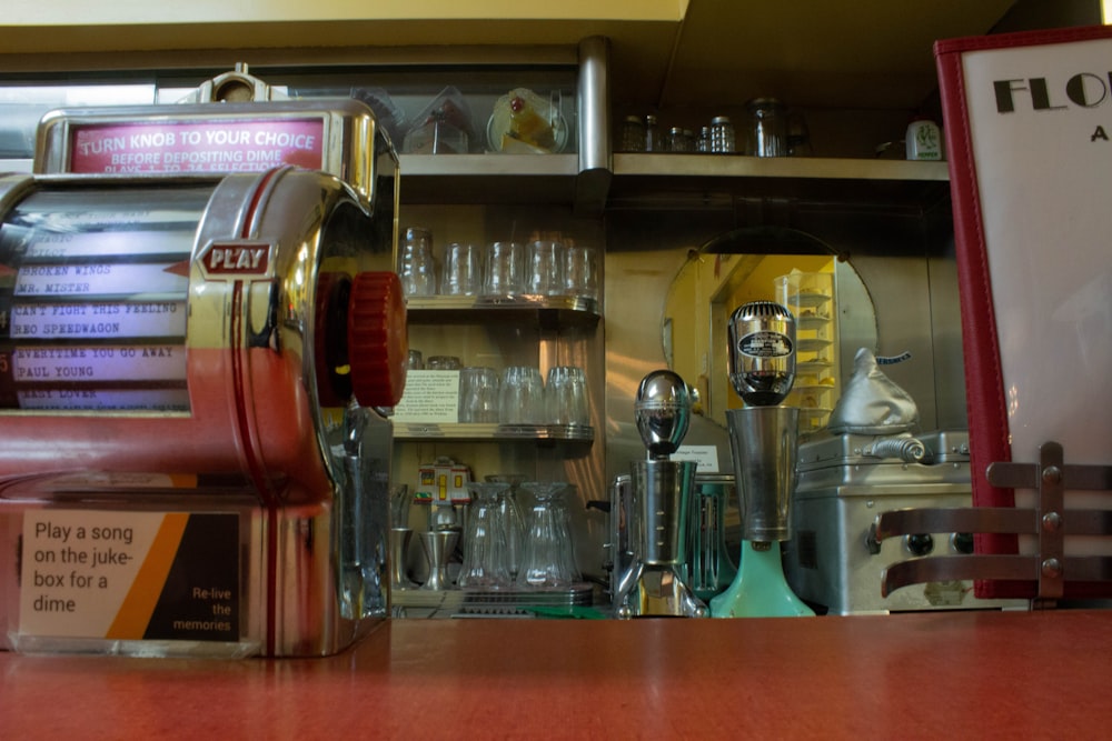 a coffee machine sitting on top of a wooden counter