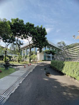 A completed commercial building surrounded by landscaped greenery.