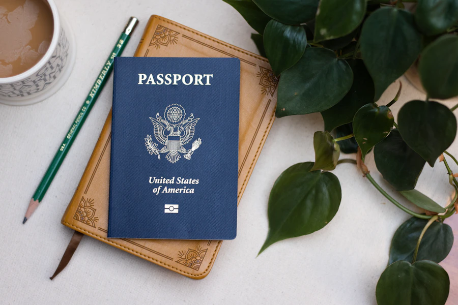 US passport on a leather notebook with morning coffee