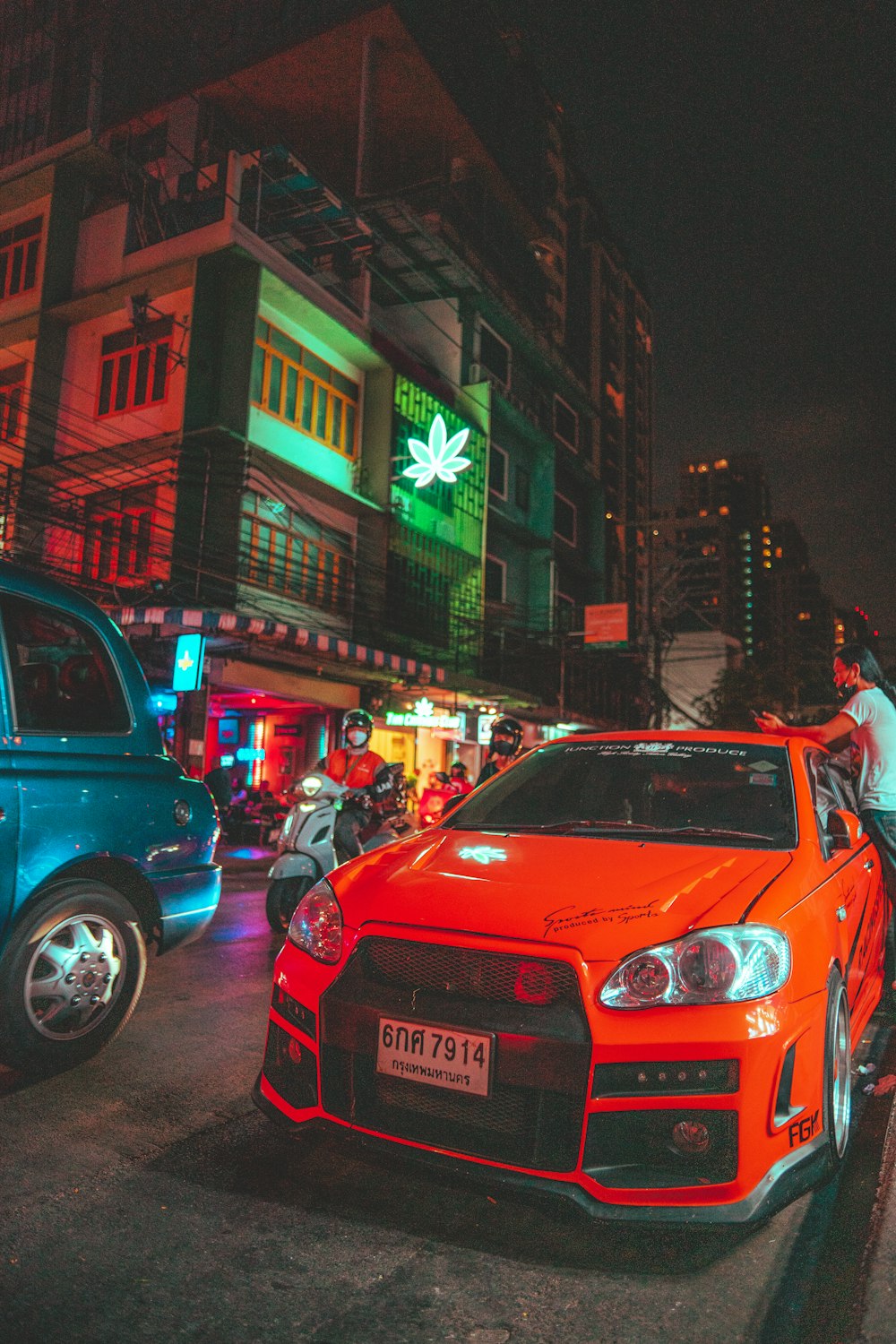 a red car parked on the side of the road