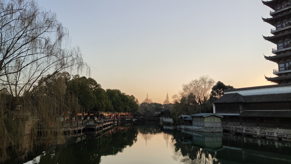 a body of water with buildings in the background