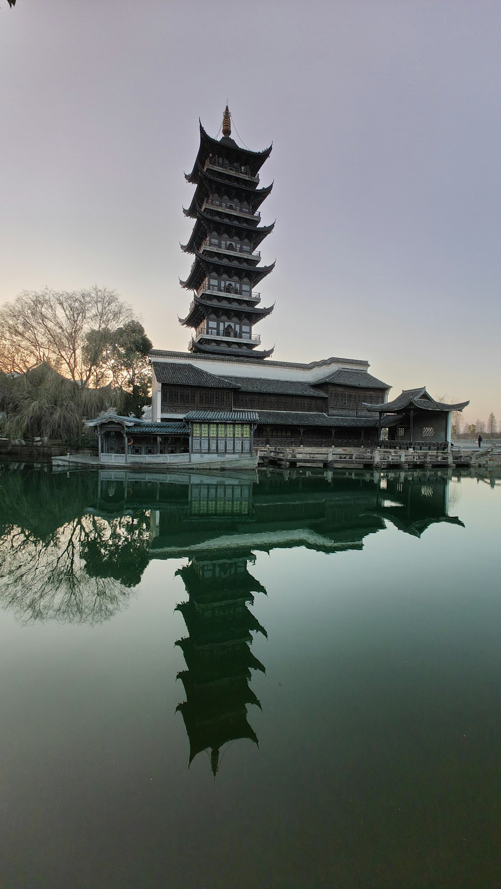 a tall building sitting next to a body of water