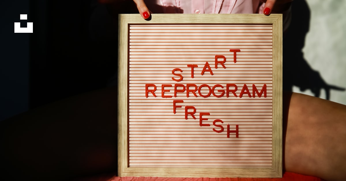 A person holding a sign that says start reprogram fresh photo – Free ...