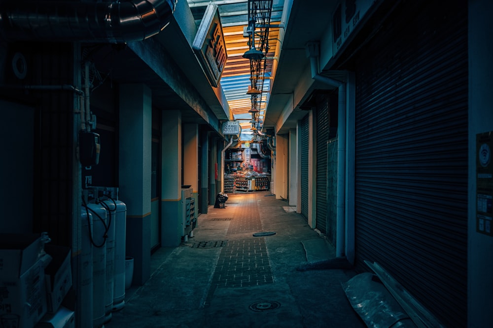 a narrow alley way with a skylight above it