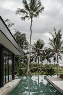 An AI-created scene featuring a luxury hotel poolside with sparkling water and palm trees.