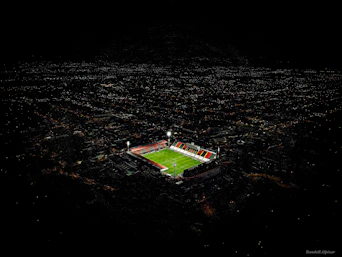 an aerial view of a soccer field at night