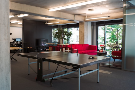 a ping pong table in an office setting