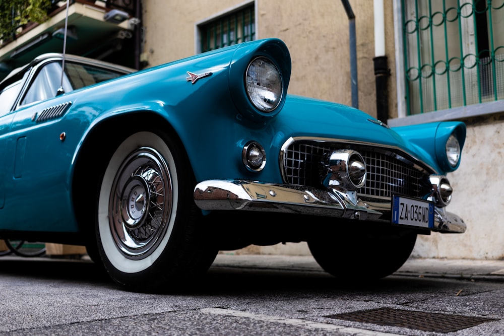 a blue car parked on the side of the road