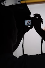 a person taking a picture with a camera