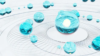 a group of blue balls sitting on top of a white surface