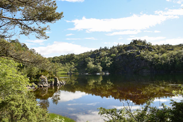 A beautiful lakeside parcel at Lago Rapel with calm water and lush trees surrounding the area.