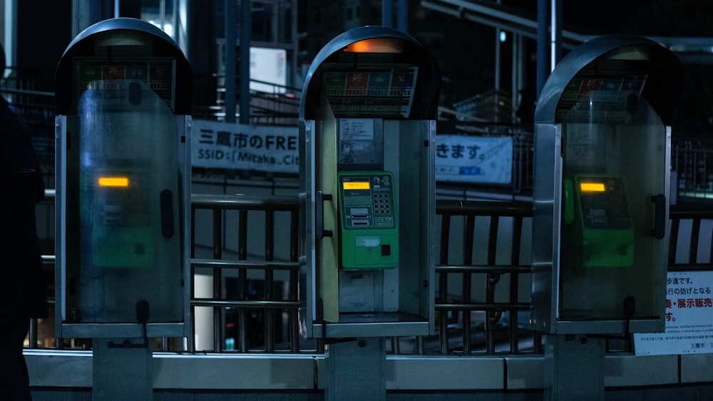 a row of parking meters sitting next to each other